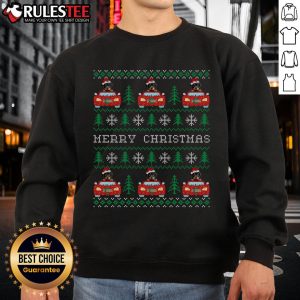 Rottweiler in a Santa hat on a car wearing an Awesome Ugly Christmas sweatshirt for festive holiday celebrations.