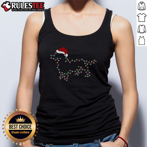 Cute Dachshund dog wearing a Santa hat and Christmas tank top, surrounded by festive holiday lights. Perfect for Xmas!