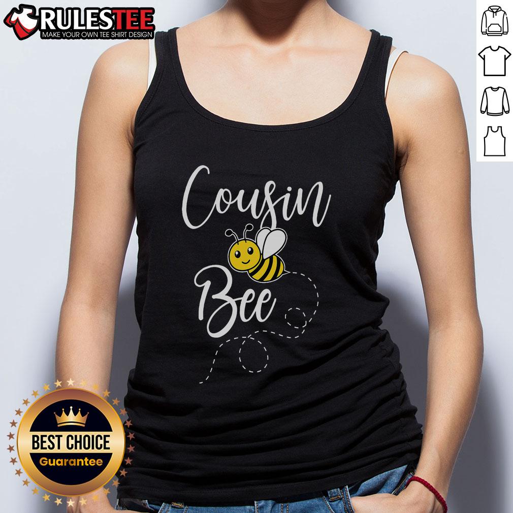 Adorable cousin in matching birthday tank top for Bee Day, celebrating with family in a festive hive-themed setting.