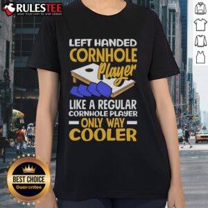 Awesome left-handed cornhole player showcasing skills in a cool ladies tee, perfect for fun outdoor games.