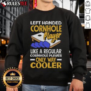 Awesome left-handed cornhole player wearing a cooler sweatshirt, showcasing skill and style in a competitive game.