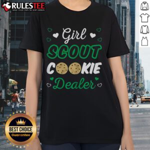 Adorable girl wearing a 'Cute Girl Scout Cookie Dealer' tee, promoting cookies with a smile and vibrant energy.