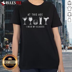 Funny 'At This Age I Need My Glasses' drink ladies tee featuring humorous text and playful design for casual wear.
