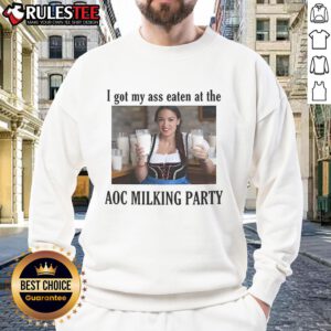 Funny sweatshirt reading 'I Got My Ass Eaten at the AOC Milking Party' with vibrant colors and playful design.