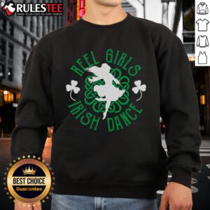 Funny Irish step dancer in vibrant sweatshirt performing a lively step dancing reel at a festive event.