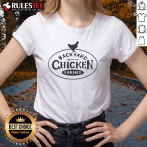 Adorable backyard chicken farmer wearing a 'Chicken Lover' tee, showcasing love for chickens in a sunny garden setting.