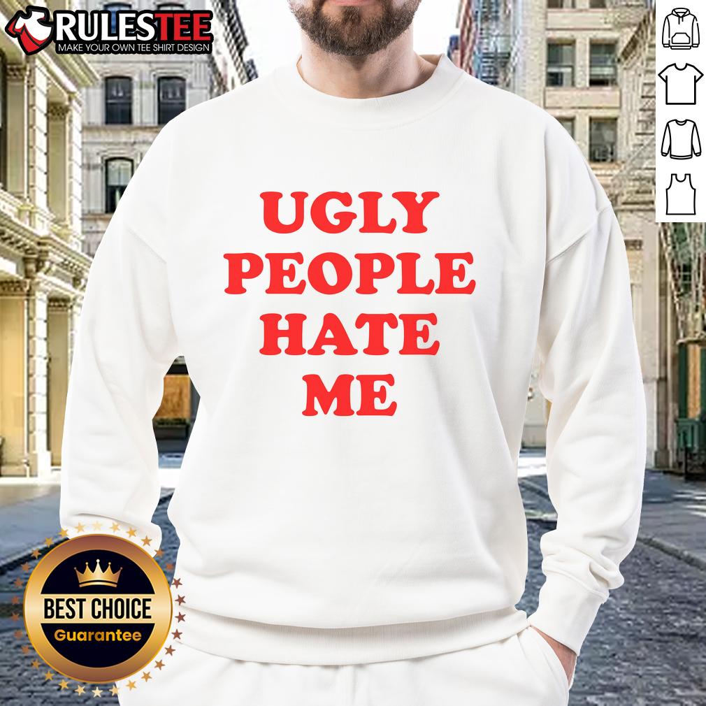 Funny ugly people hate me sweatshirt featuring bold text and a playful design, perfect for quirky fashion lovers.