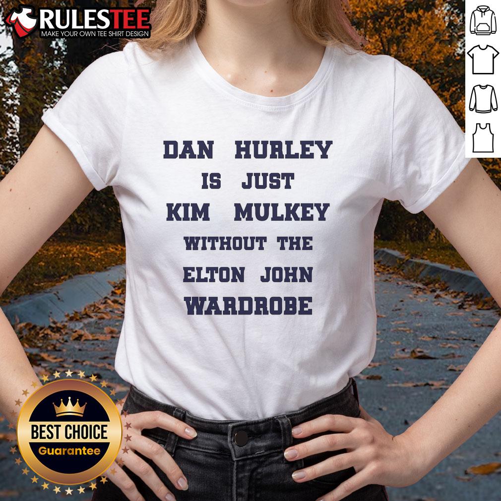 Good Dan Hurley in casual wear, resembling Kim Mulkey's style sans Elton John's wardrobe on a ladies tee.