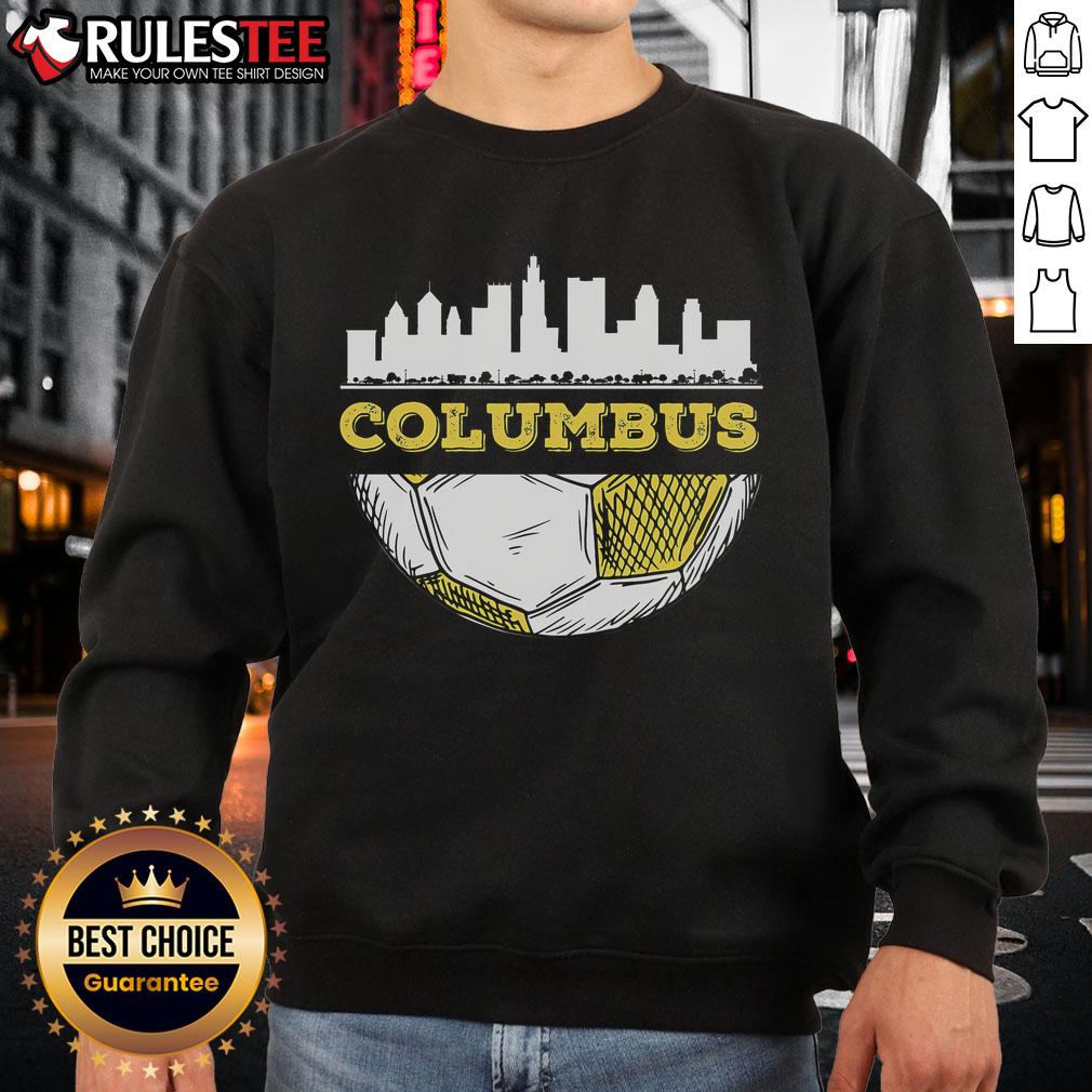 Columbus skyline with a soccer lover wearing an Awesome Columbus Soccer Lover sweatshirt, showcasing city pride.