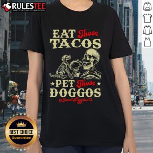 Skeleton ladies in taco-themed shirts enjoying tacos and petting dogs, showcasing the Awesome Eat Those Tacos Pet Those Doggos Tee.