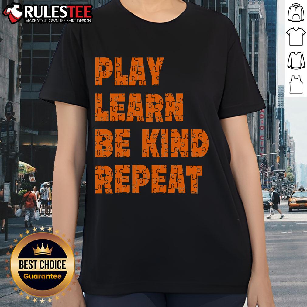 Orange ladies tee with 'Play, Learn, Be Kind, Repeat' design for Autism Awareness Unity Day, promoting kindness and inclusion.