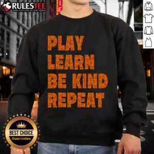 Orange sweatshirt with 'Play, Learn, Be Kind, Repeat' for Autism Awareness Unity Day, promoting kindness and inclusion.