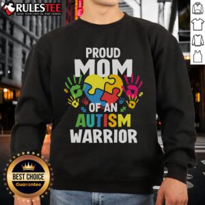 Awesome proud mom wearing sweatshirt for autism warrior son or daughter, featuring a colorful autism ribbon design.
