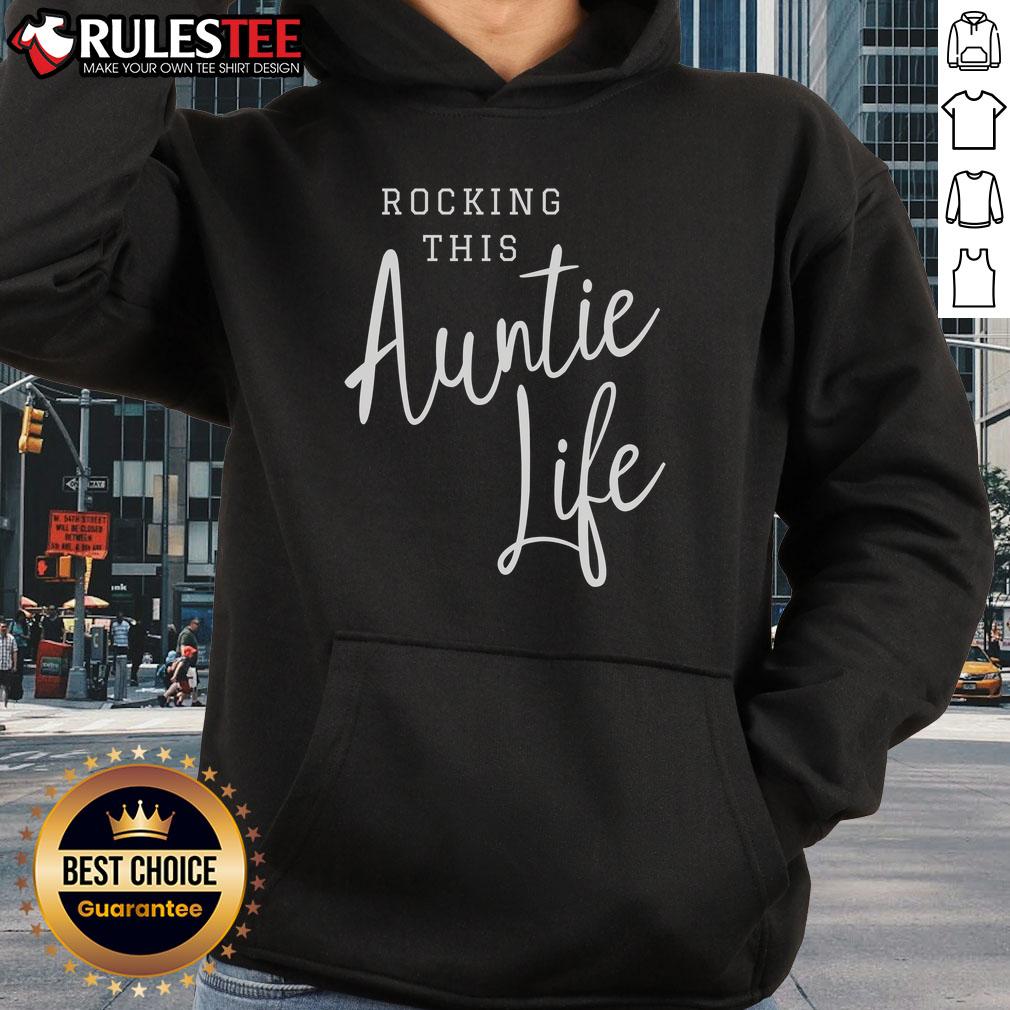 Awesome rocking this Auntie Life hoodie in a cozy setting, perfect for stylish aunties who love comfort and fun.