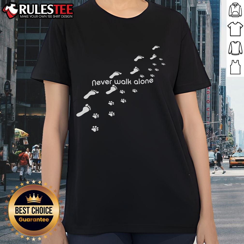 Alt Text: Cute Never Walk Alone dog owner tee featuring dog paw print design, perfect for dog lovers and pet enthusiasts.