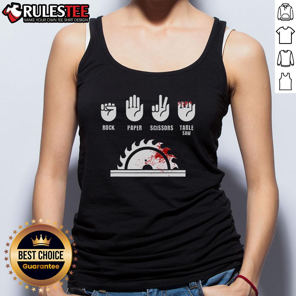 Funny carpenter in a humorous tank top playing rock-paper-scissors with a table saw, showcasing woodworking humor.