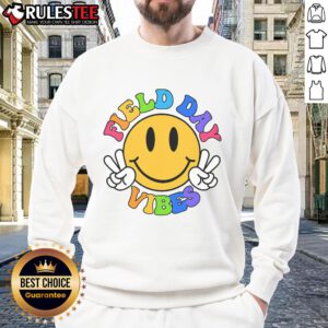 Alt Text: Teacher wearing a Funny Field Day Vibes sweatshirt at Happy Field Day 2025, enjoying outdoor activities with students.