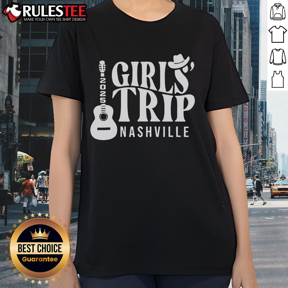 Fun bachelorette party in Nashville 2025 with ladies wearing cowboy tees celebrating on a vibrant rooftop.
