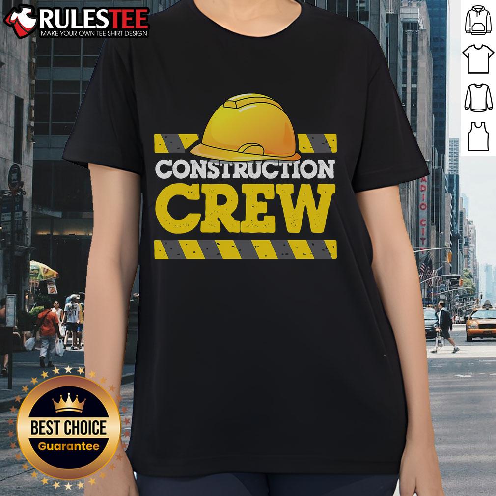 Awesome construction crew wearing construction hats and ladies' tees, showcasing teamwork and dedication on site.