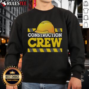 Awesome construction crew wearing hard hats and sweatshirts on a job site, showcasing teamwork and safety.