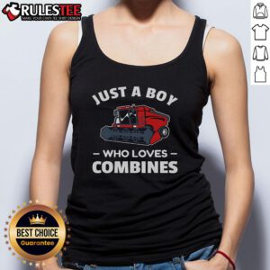 Boy wearing a tank top with a red combine harvester graphic, showcasing his love for farming and combines.