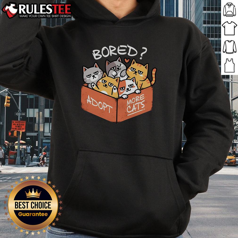 Cute bored cat wearing a hoodie with the phrase Adopt More Cats for pet lovers and adoption advocates.