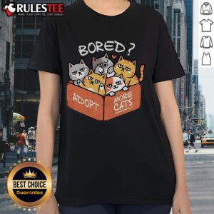 Cute bored ladies tee design promoting 'Adopt More Cats' message with playful cat graphics and vibrant colors.