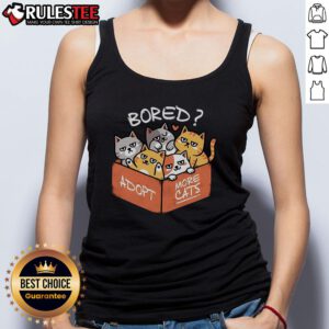 Cute bored cat wearing a tank top that says 'Adopt More Cats,' promoting pet adoption and feline love.