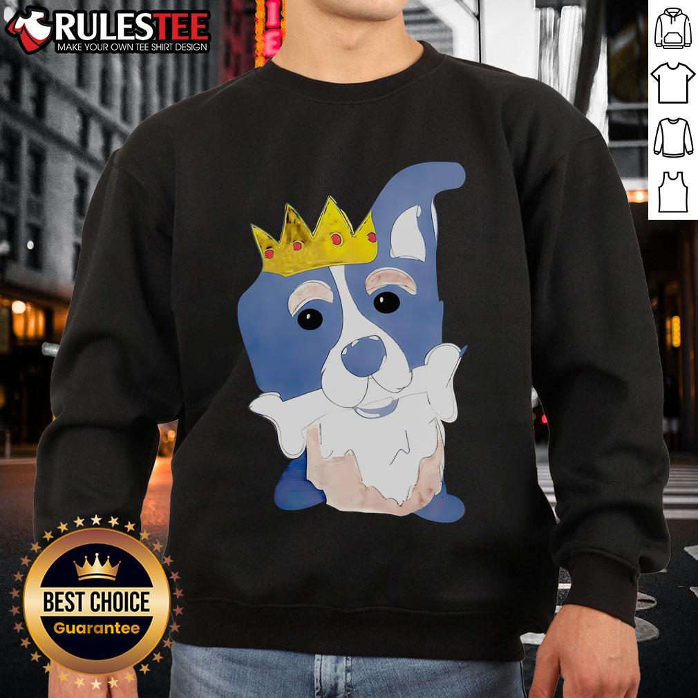 Alt Text: Cute king dog cartoon on a sweatshirt, joyfully chewing bones, perfect for dog lovers and cozy apparel.