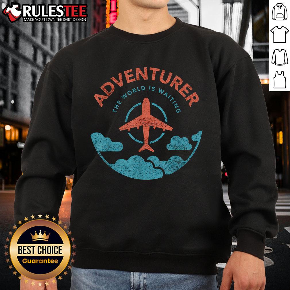 Alt Text: Funny adventurer sweatshirt featuring the phrase The World Is Waiting For Travelers with a plane graphic.