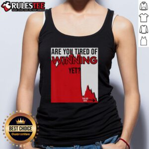 Funny tank top design reading 'Are You Tired of Winning Yet?' with market disaster and politics theme. Perfect for humor lovers.