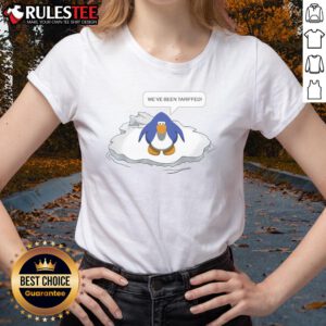 Funny Club Penguin We've Been Tariffed Ladies Tee featuring a playful design and vibrant colors, perfect for fans.