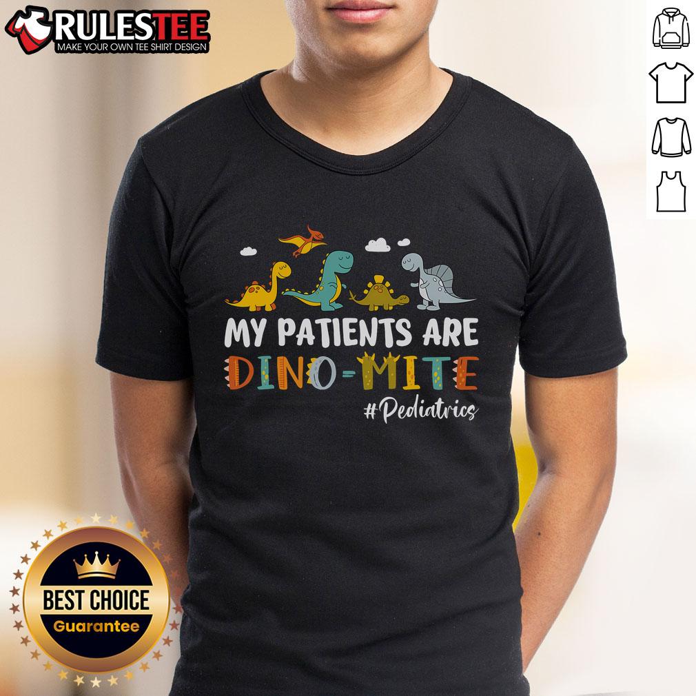Alt Text: Pediatric nurse wearing 'My Patients Are Dino-Mite' dinosaur T-shirt, showcasing fun and caring approach to child healthcare.