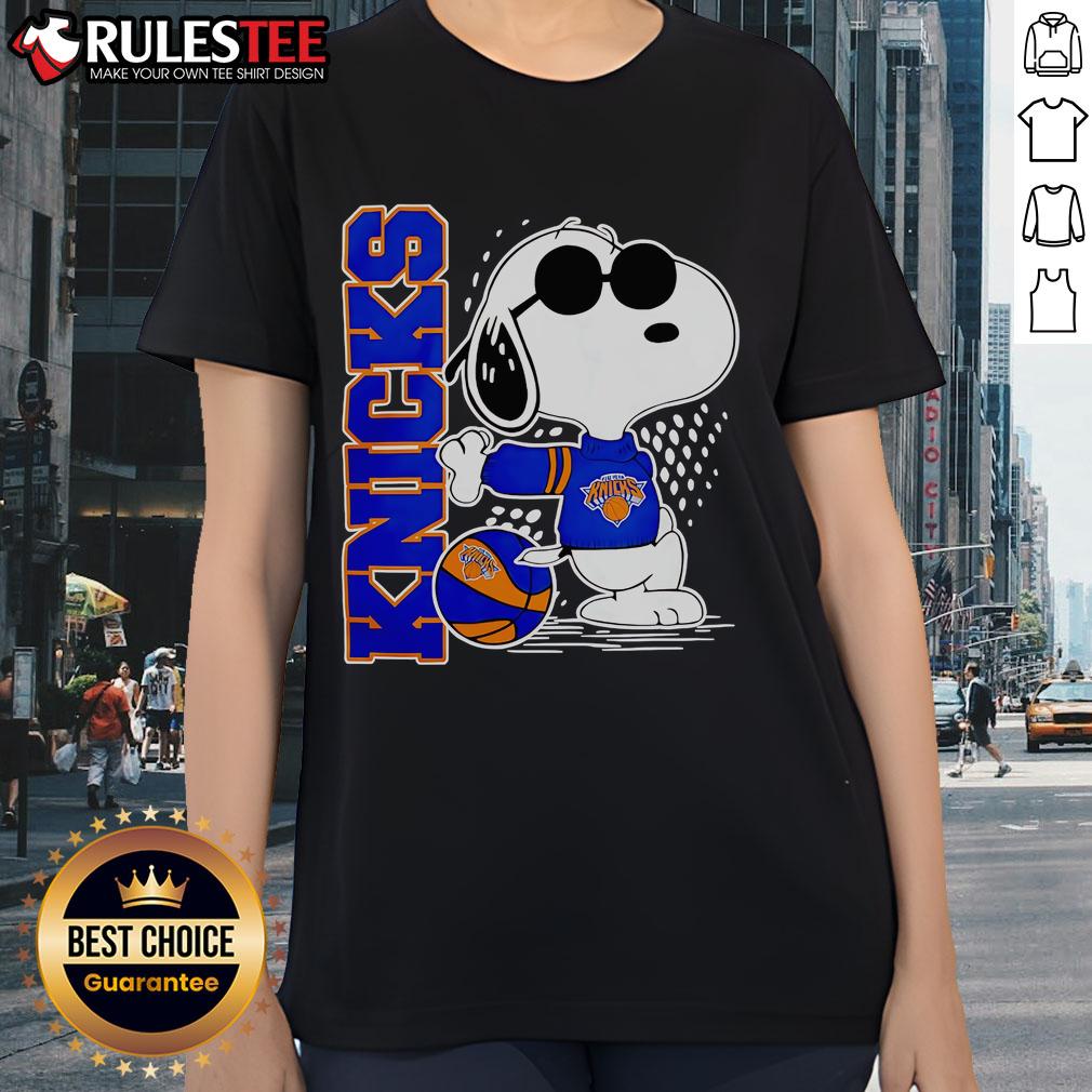 Alt Text: Awesome Peanuts Snoopy New York Knicks Basketball 2025 Ladies Tee featuring a playful Snoopy design and Knicks colors.