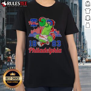Alt Text: Awesome Phillie Phanatic mascot with Philadelphia skyline on a ladies tee, perfect for Phillies fans.