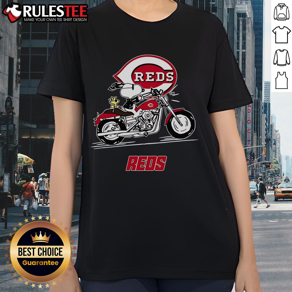Alt Text: Snoopy and Woodstock riding a motorbike on a Cincinnati Reds ladies tee, perfect for fans and casual wear.