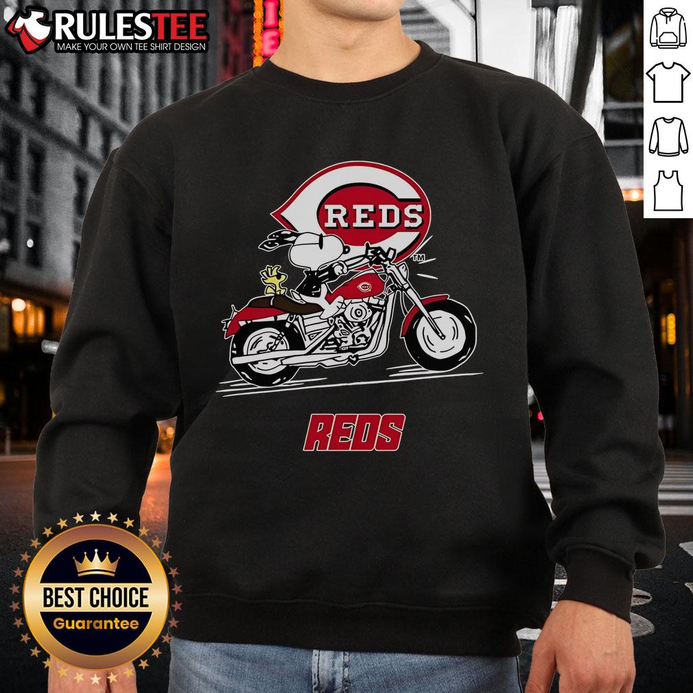 Awesome Snoopy and Woodstock driving a motorbike on a Cincinnati Reds sweatshirt, perfect for fans and collectors.