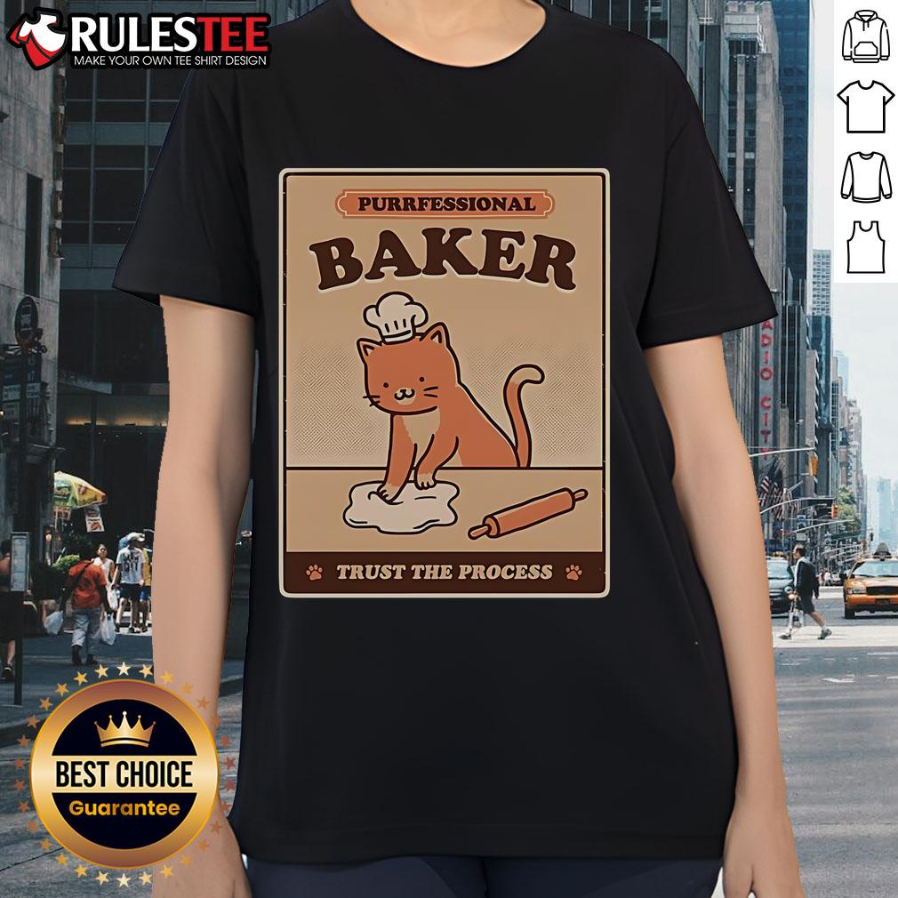 Alt Text: Cute cat wearing a chef hat and apron, showcasing the 'Purrfessional Baker' tee design for ladies. Trust the process!