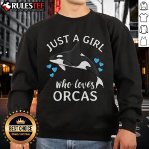 Alt Text: Cute girl wearing a sweatshirt that says Just a Girl Who Loves Orcas with killer whales in a vibrant ocean setting.