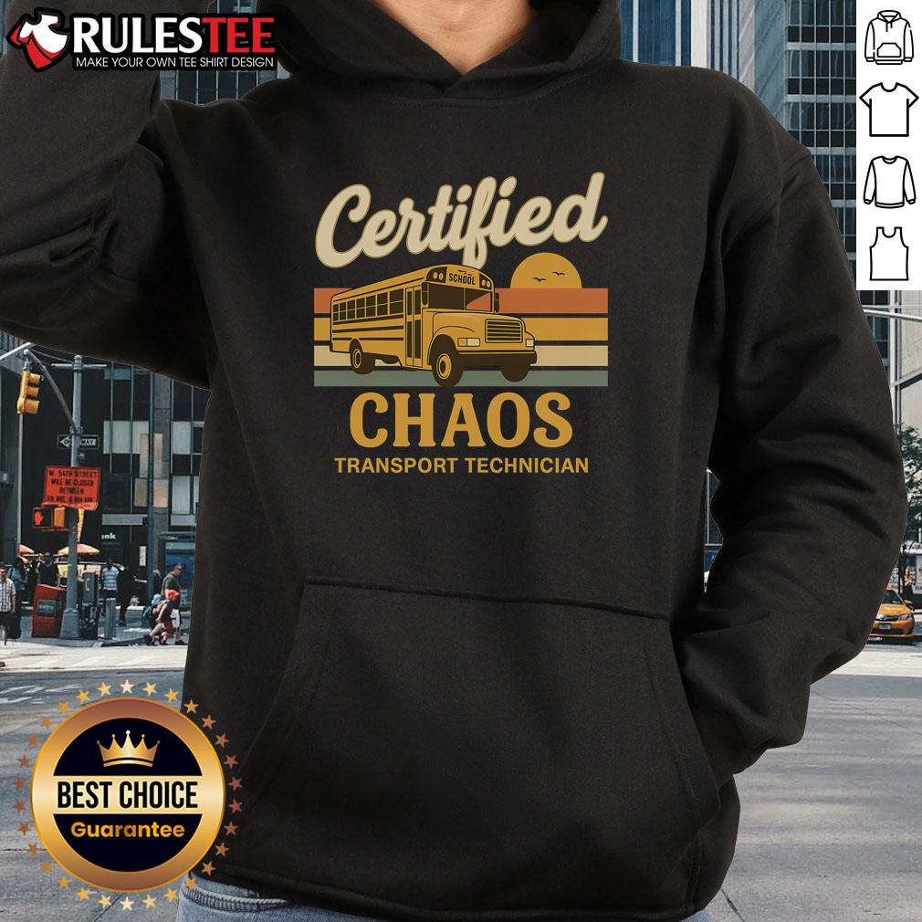 Alt Text: Humorous 'Certified Chaos Transport Technician' hoodie worn by a school bus driver, featuring vibrant graphics and playful design.