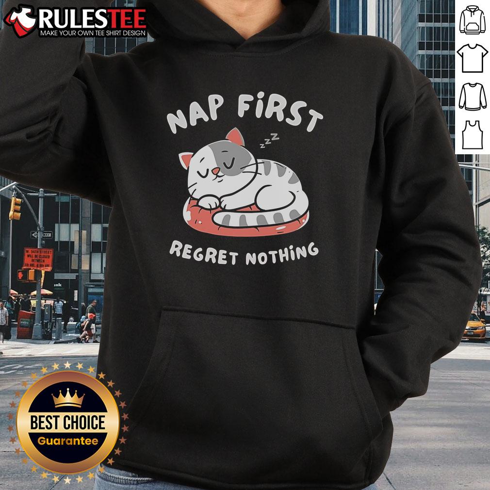 Cute cat napping in a cozy hoodie with 'First Regret Nothing' printed, perfect for cat lovers and comfy fashion enthusiasts.