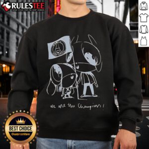 Cute Luis Enrique wearing a 'We Are The Champions' PSG sweatshirt, showcasing team pride for Paris Saint-Germain.
