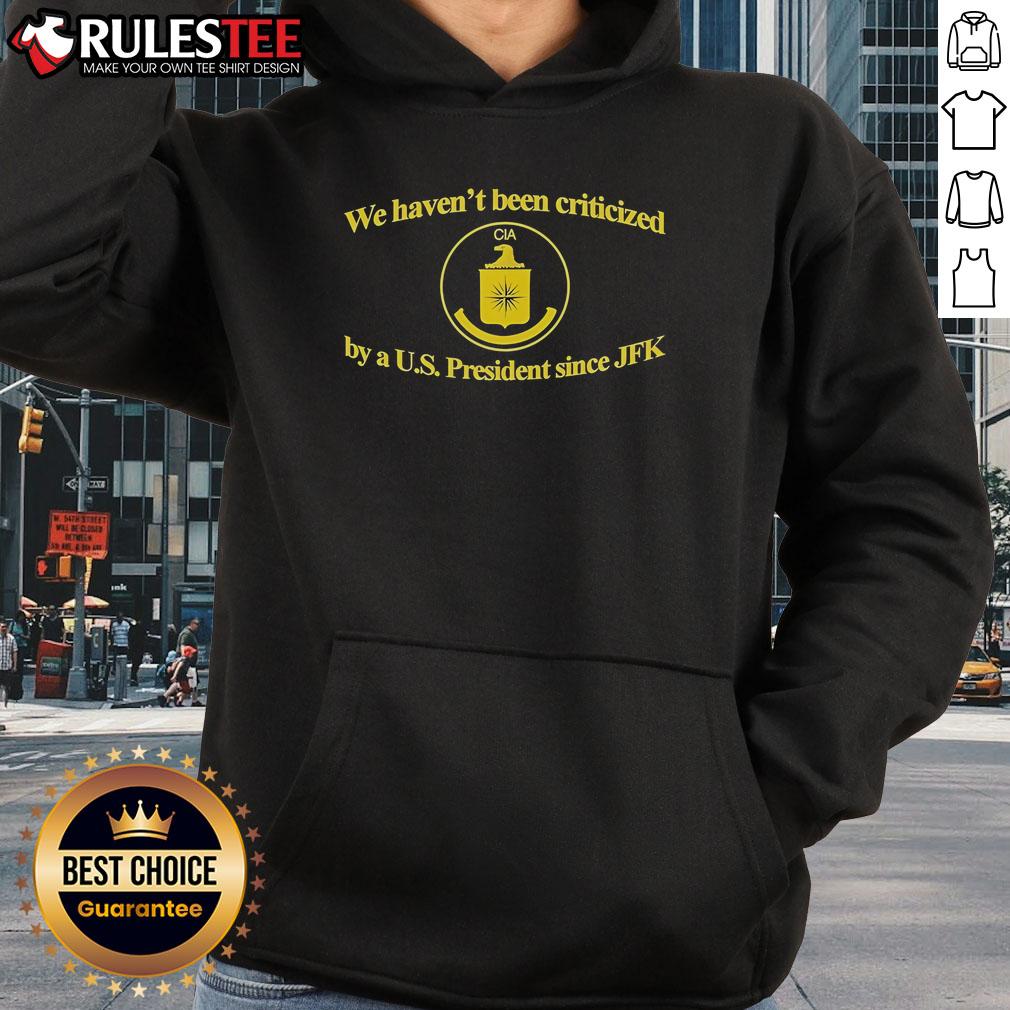 Funny CIA hoodie featuring 'We Haven't Been Criticized By A US President Since JFK' slogan, perfect for humor lovers.