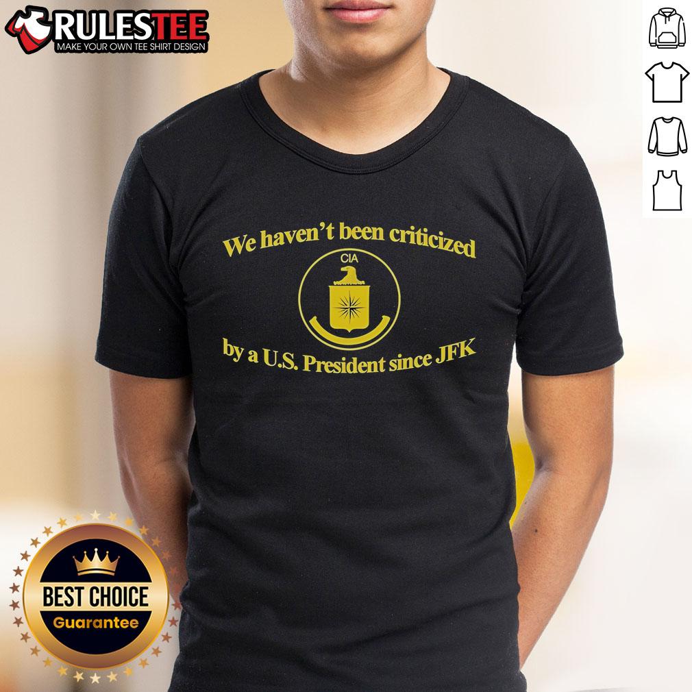 Alt Text: Funny CIA We Haven't Been Criticized By A US President Since JFK T-Shirt showcasing humor about U.S. history.