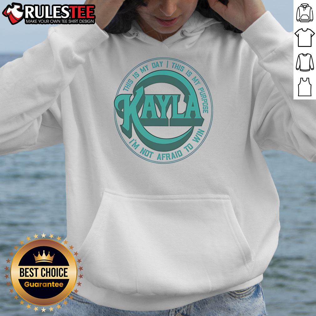 Kayla Harrison wearing a concert hoodie with 'This Is My Day, This Is My Purpose, I'm Not Afraid To Win' design.