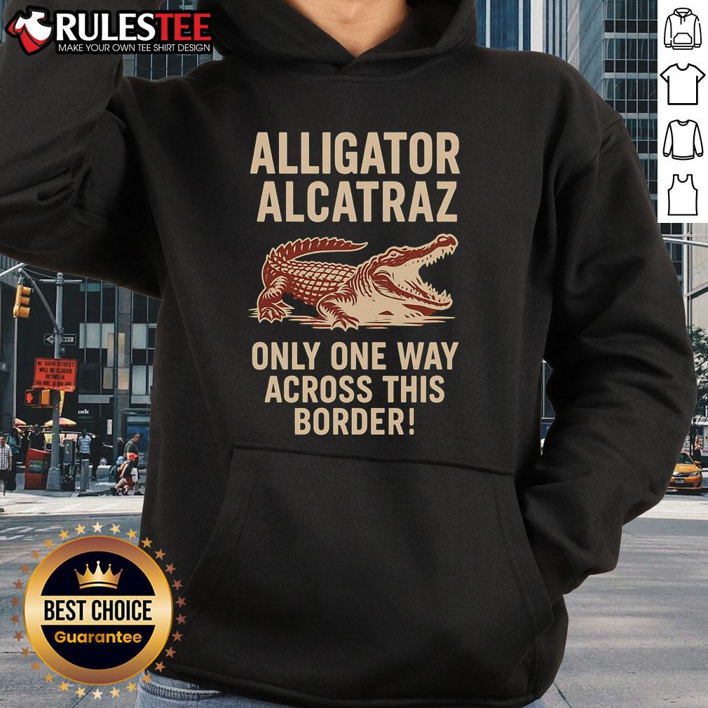 Funny Alligator Alcatraz hoodie with a playful design featuring a cartoon gator crossing a border. Perfect for unique fashion!