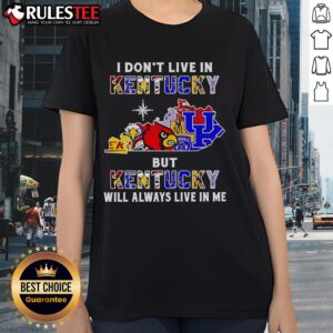 Alt Text: Ladies tee featuring 'I Don't Live in Kentucky But Kentucky Will Always Live in Me' for sports fans.