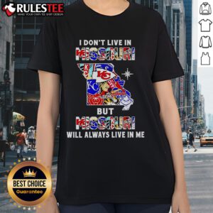 Ladies tee featuring 'I Don't Live In Missouri But Missouri Will Always Live In Me' with sports team graphics.