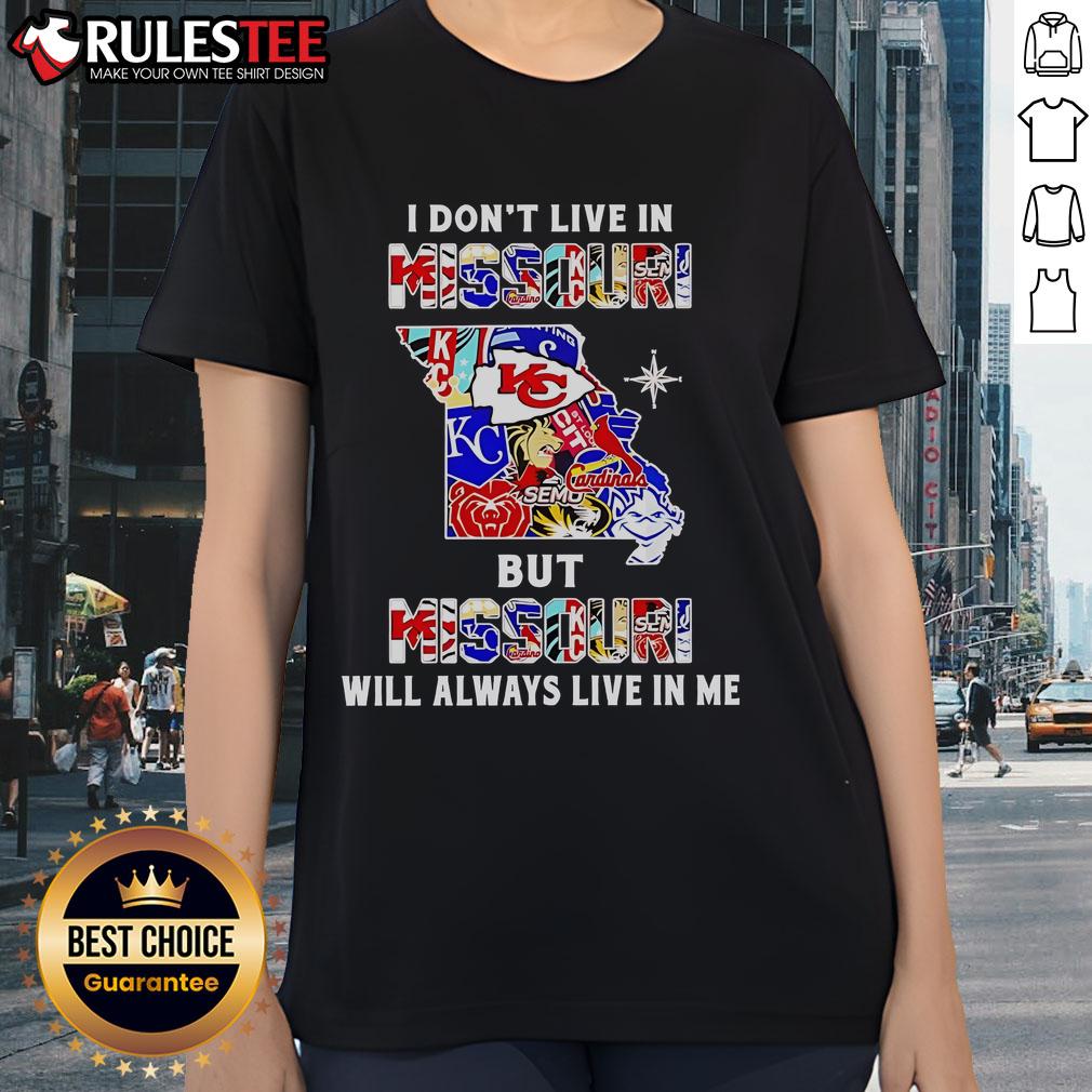 Ladies tee featuring 'I Don't Live In Missouri But Missouri Will Always Live In Me' with sports team graphics.