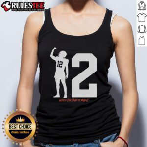 Alt Text: Shedeur Sanders wearing a Cleveland Browns tank top with When The Time Is Right design, showcasing team spirit.